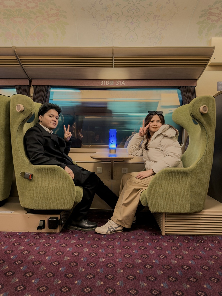 Clarence and Laine on the train, December 2026