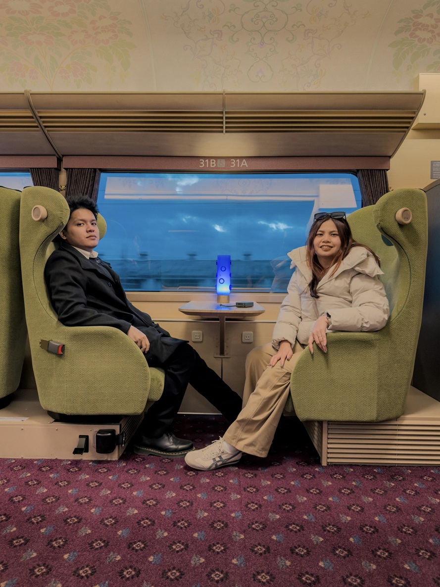 Clarence and Laine on the train, December 2026